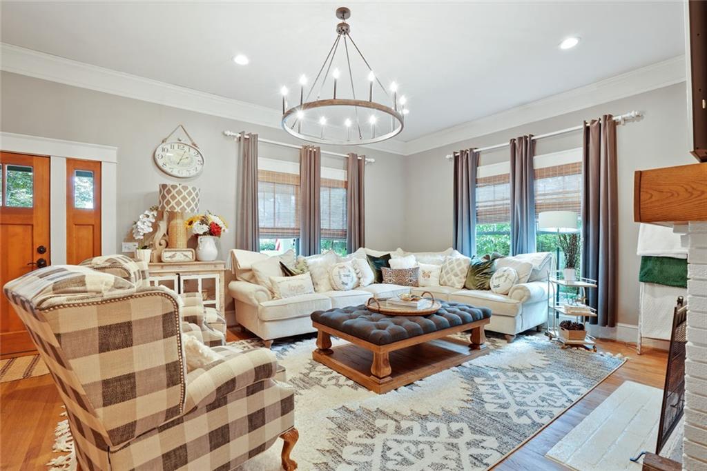 745 Washington Street Clarkesville, GA 30523 - Photo 10 of 54 a living room with fireplace furniture and a large window