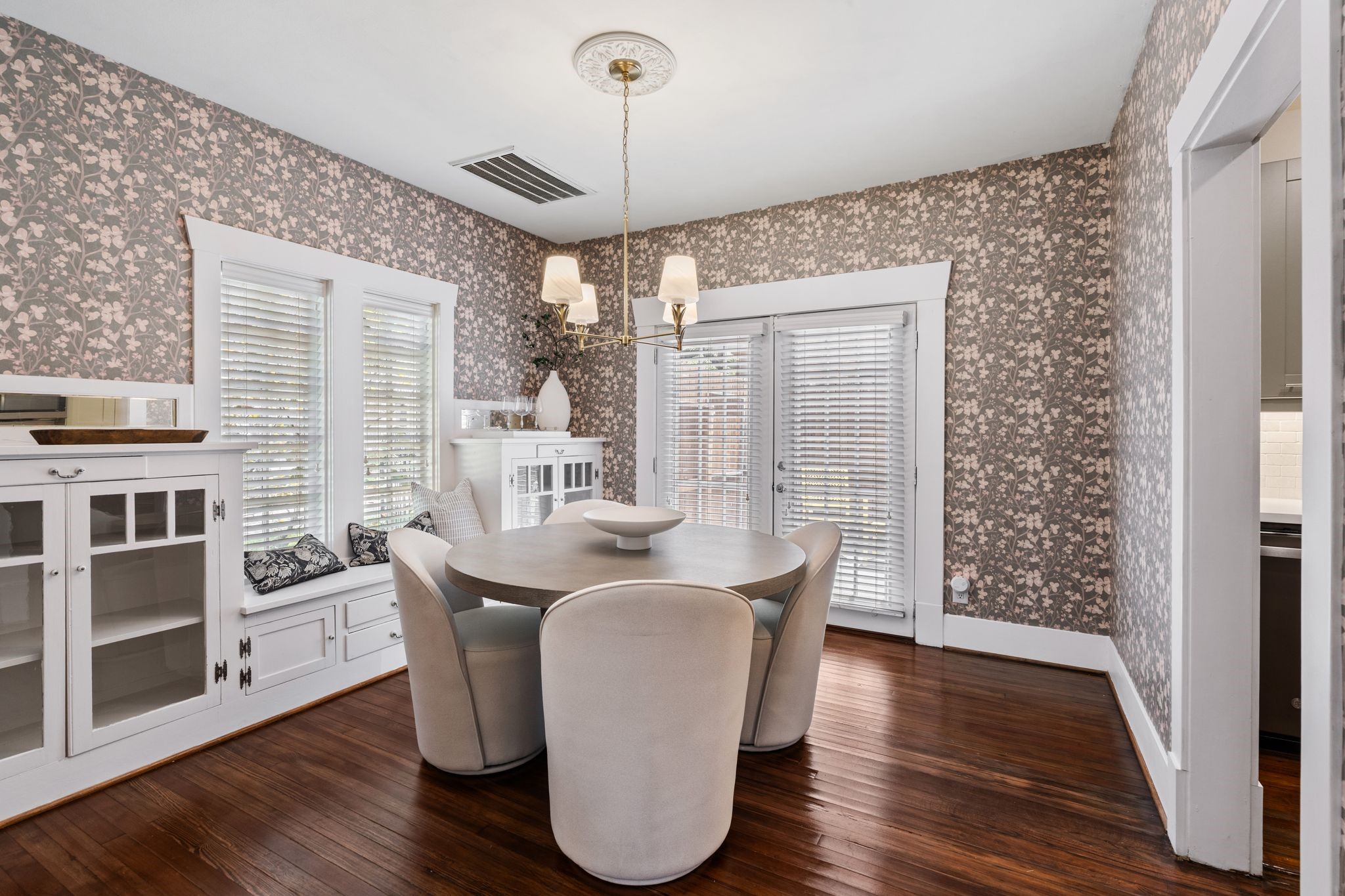714 Ridge Street Houston, TX 77009 - Photo 7 of 36 Plan your next dinner party in this stunning formal dining room wrapped in designer wallpaper. A lovely chandelier descends from a classic ceiling medallion.