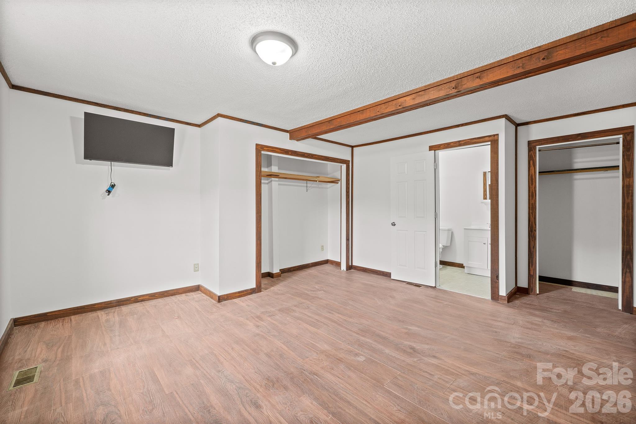 7400 Corn Hill Road Connelly Springs, NC 28612 - Photo 20 of 41 an empty room with wooden floor and windows