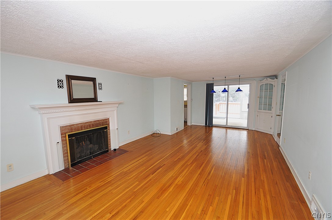 606 Roxford Road South Salina, NY 13208 - Photo 4 of 30 Living Room/Dining Combo with Slider to Sunroom