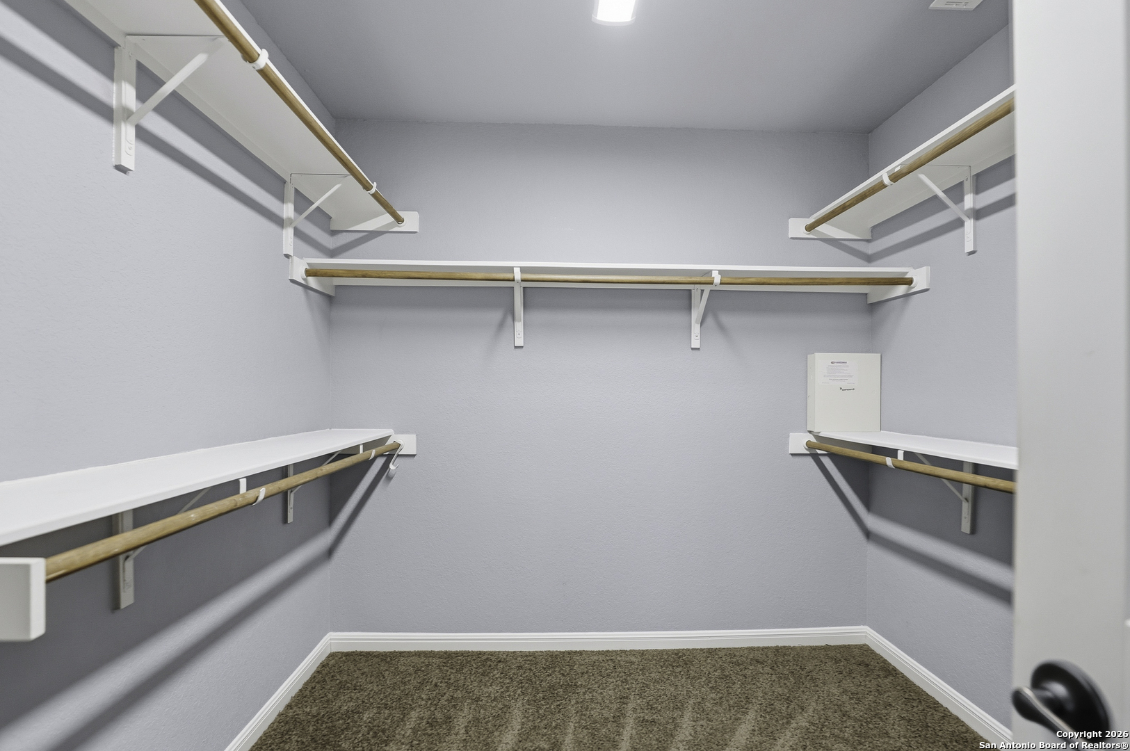 829 Laserra Cibolo, TX 78108 - Photo 11 of 15 a view of storage and utility room with racks on the wall