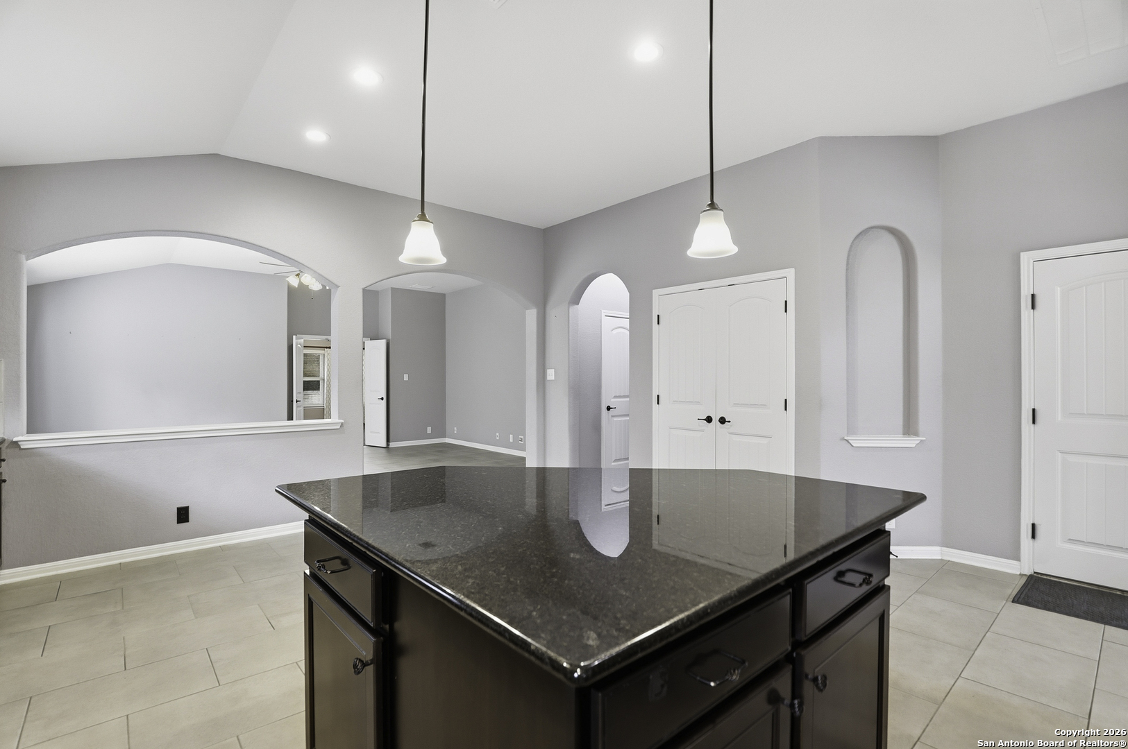 829 Laserra Cibolo, TX 78108 - Photo 4 of 15 a kitchen with a kitchen island a sink stainless steel appliances and cabinets