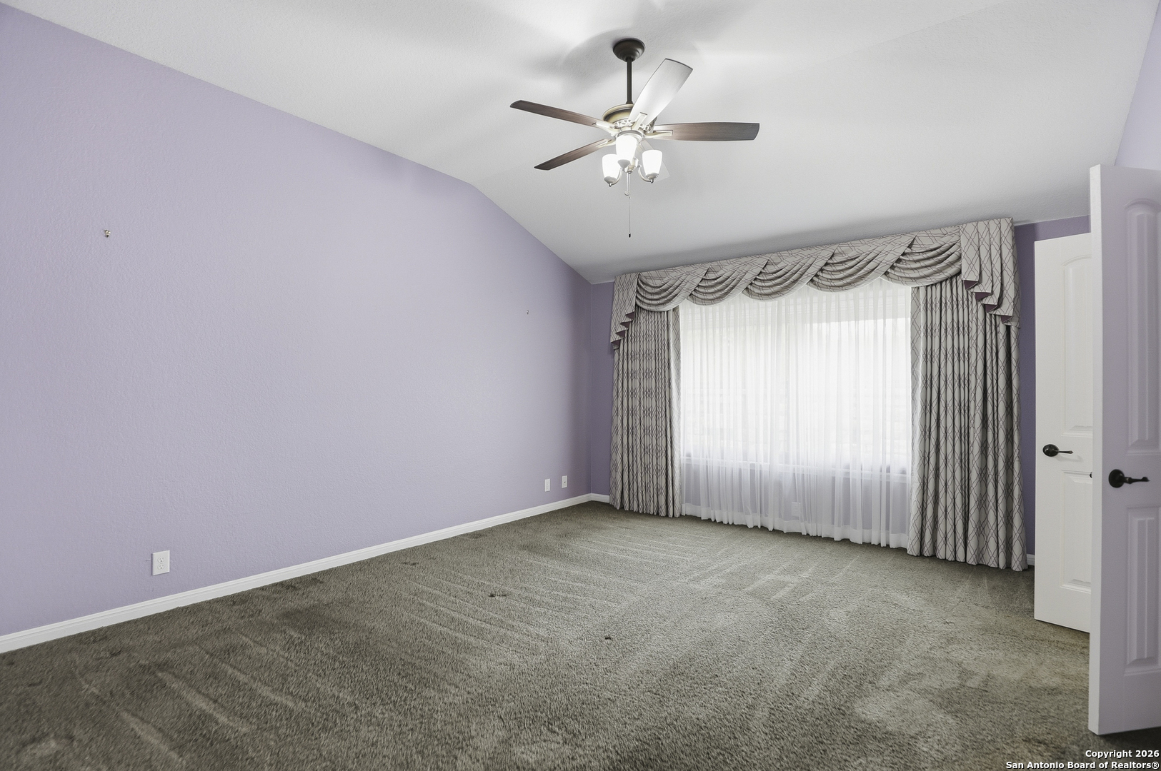 829 Laserra Cibolo, TX 78108 - Photo 8 of 15 an empty room with a window and a fan