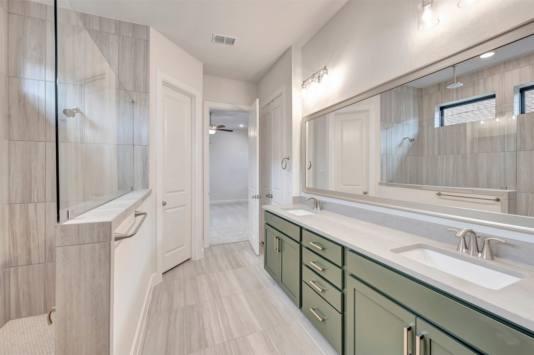 2718 Cottage Place Rosharon, TX 77583 - Photo 35 of 50 a spacious bathroom with a double vanity sink a mirror and a shower