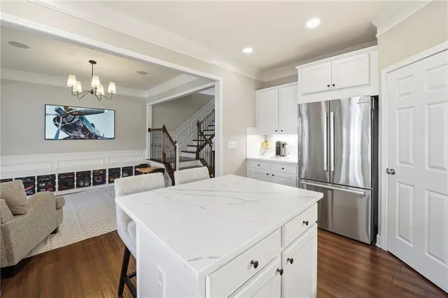 a kitchen with stainless steel appliances a refrigerator and a refrigerator
