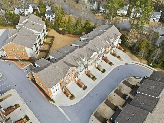 an aerial view of a house with outdoor space