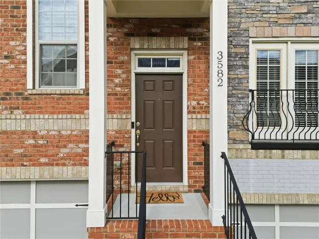 a front view of a house with a glass door
