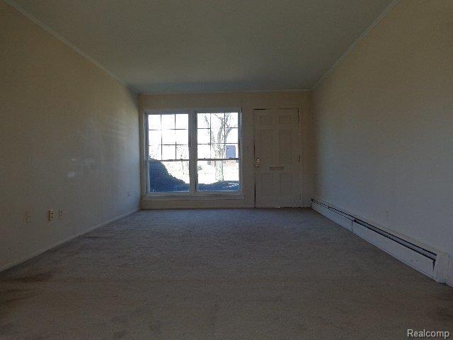 2821 West Thirteen Mile Road, Unit 2 Royal Oak, MI 48073 - Photo 20 of 23 261-843021 Living Room b.JPG