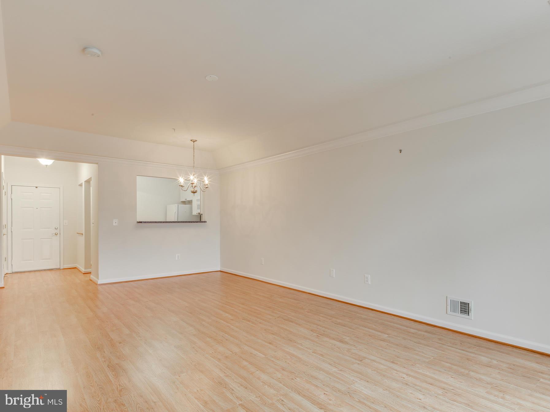 7305 Maplecrest Road, Unit 208 Elkridge, MD 21075 - Photo 13 of 30 a view of empty room with wooden floor