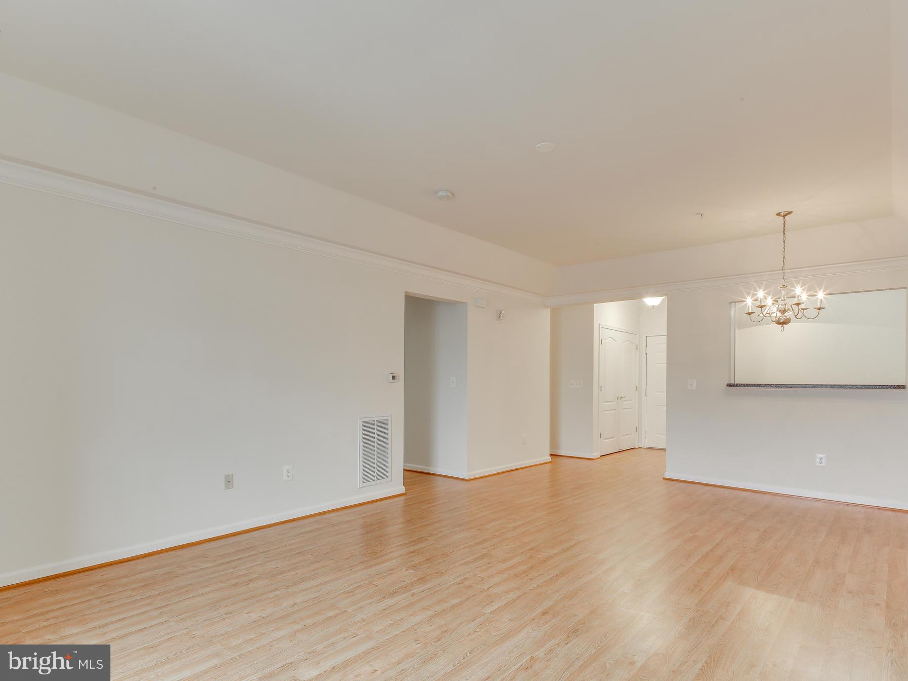 7305 Maplecrest Road, Unit 208 Elkridge, MD 21075 - Photo 14 of 30 a view of an empty room with wooden floor