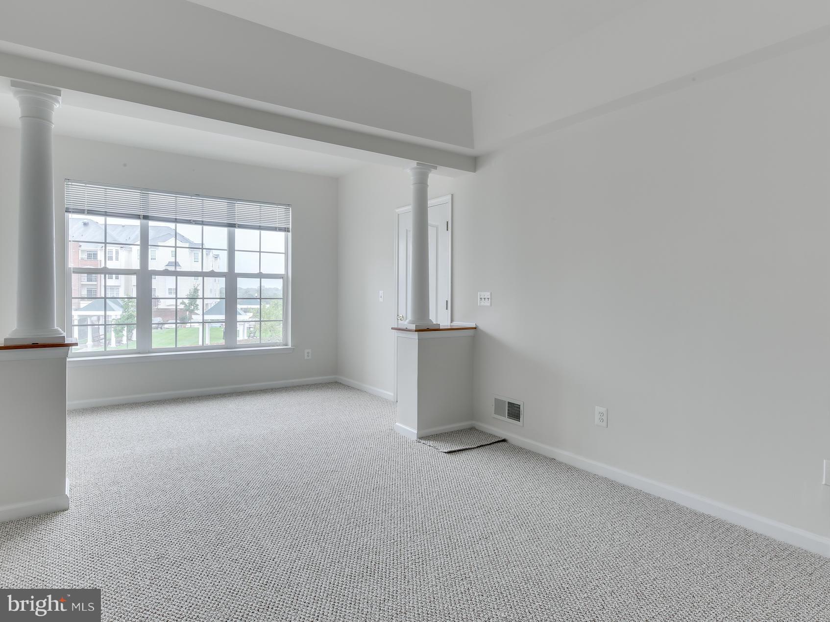7305 Maplecrest Road, Unit 208 Elkridge, MD 21075 - Photo 20 of 30 an empty room with windows