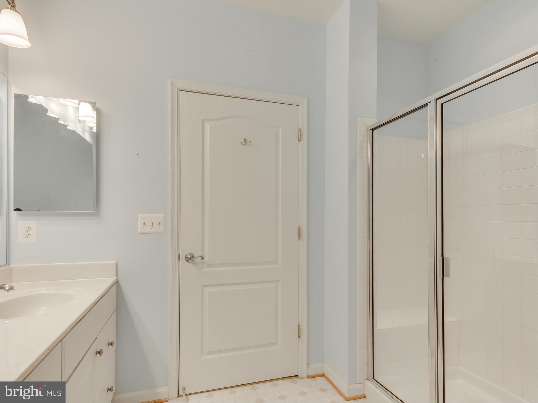 7305 Maplecrest Road, Unit 208 Elkridge, MD 21075 - Photo 22 of 30 a bathroom with a sink and shower