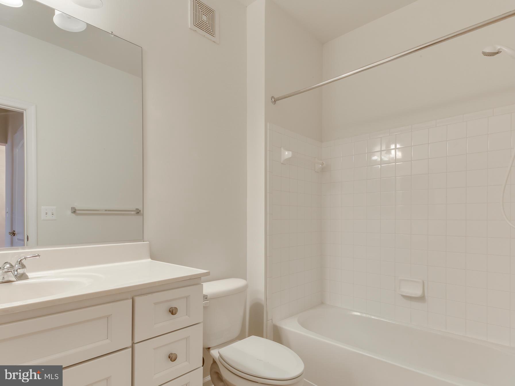 7305 Maplecrest Road, Unit 208 Elkridge, MD 21075 - Photo 24 of 30 a bathroom with a sink a toilet and shower
