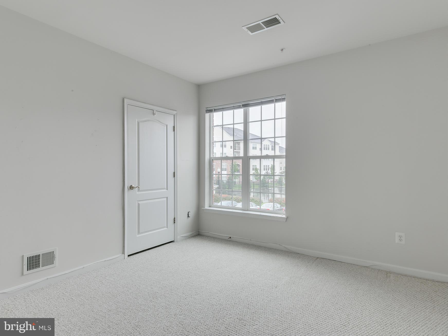 7305 Maplecrest Road, Unit 208 Elkridge, MD 21075 - Photo 26 of 30 an empty room with a window