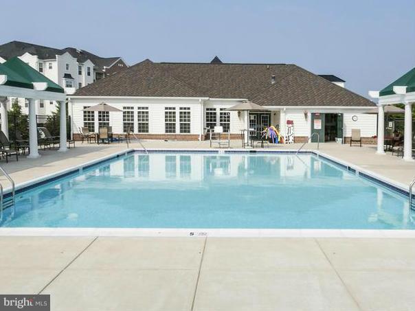 7305 Maplecrest Road, Unit 208 Elkridge, MD 21075 - Photo 29 of 30 a view of house with swimming pool and a yard