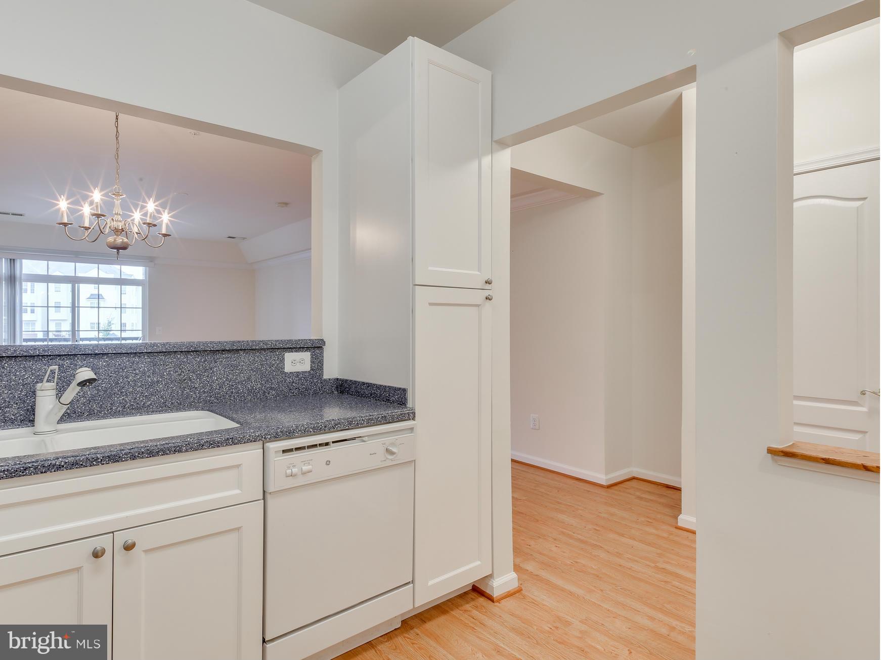 7305 Maplecrest Road, Unit 208 Elkridge, MD 21075 - Photo 9 of 30 a bathroom with a granite countertop sink and a mirror