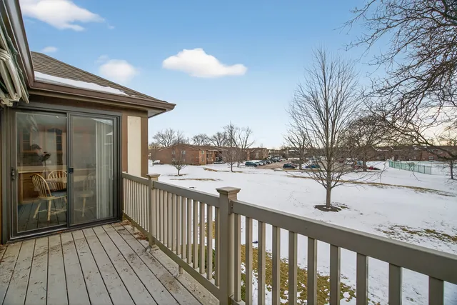 a view of a balcony with wooden floor