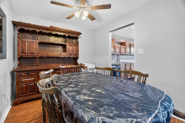 a view of a dining room with furniture and wooden floor