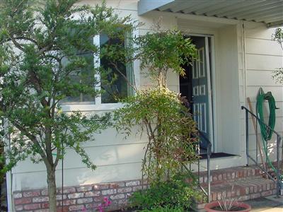 1945 Piner Road, Unit 128 Santa Rosa, CA 95403 - Photo 2 of 10 a view of a house with a tree