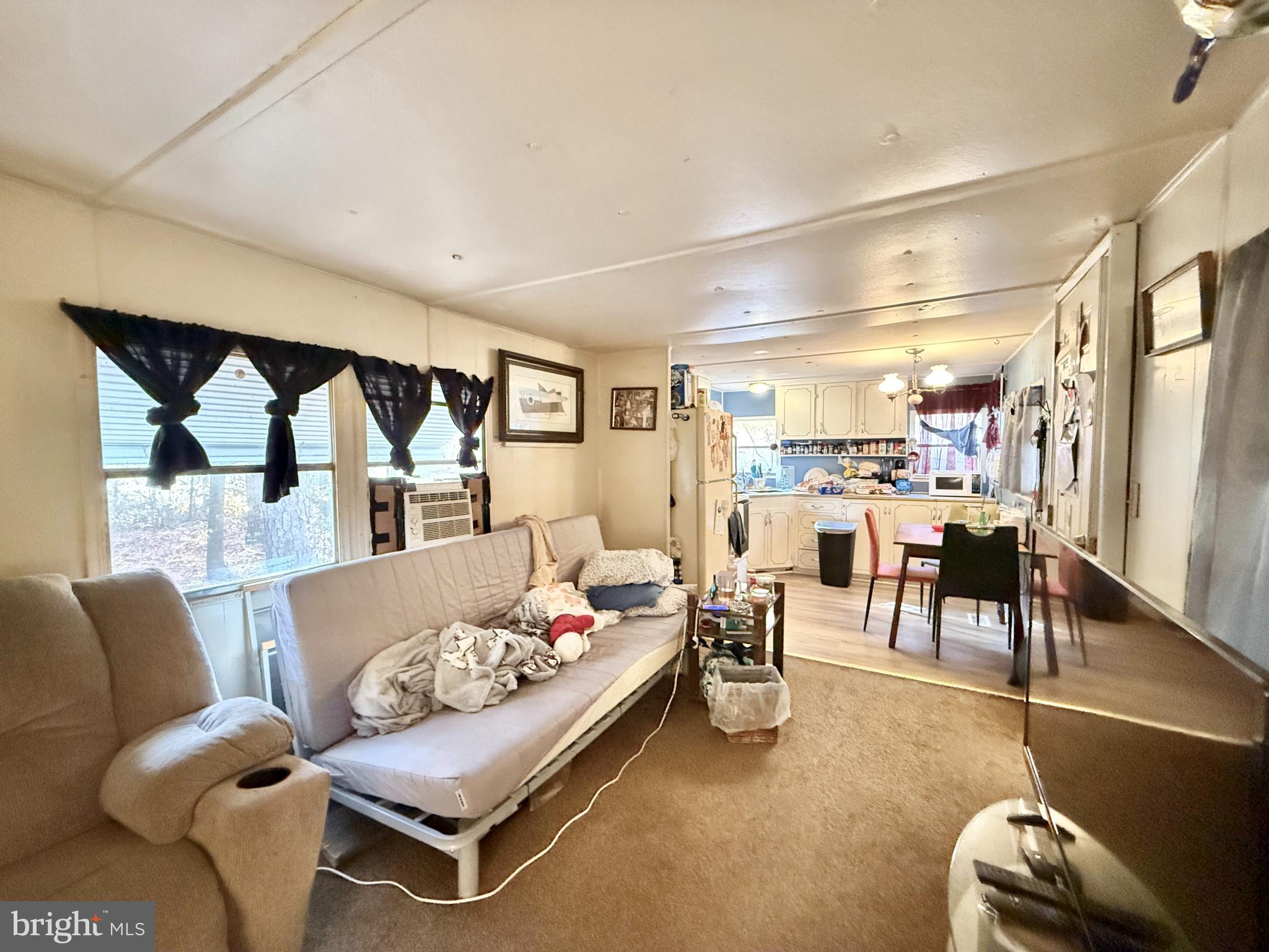 250 Jute Road Millville, NJ 08332 - Photo 4 of 11 a living room with furniture and a large window