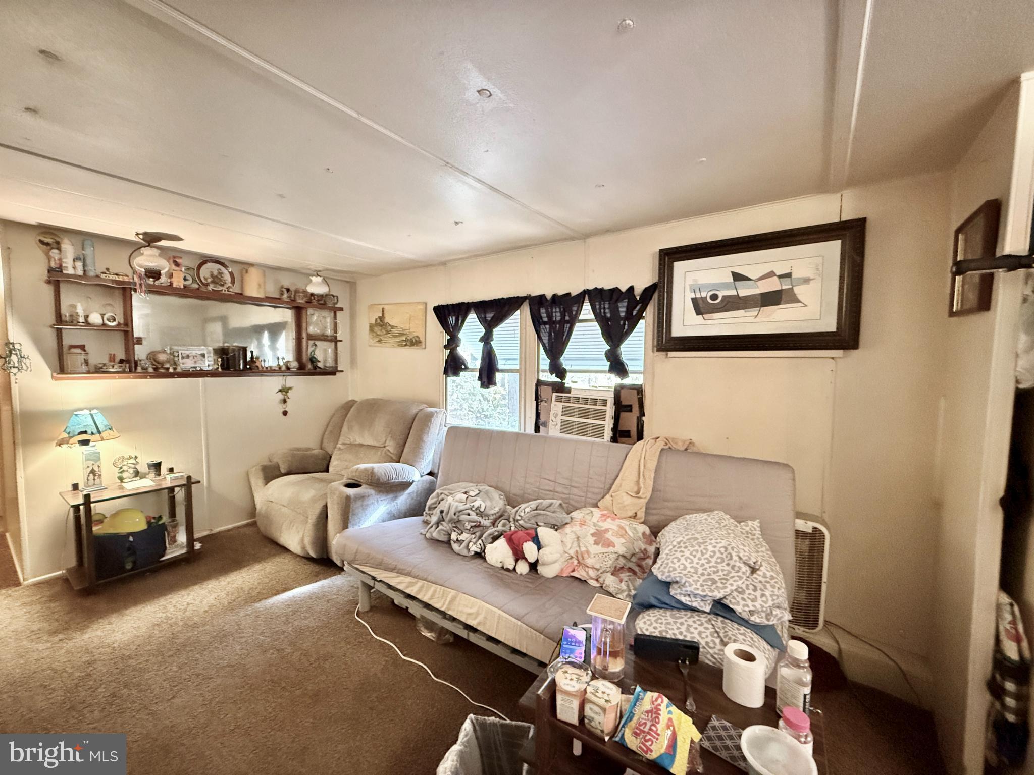 250 Jute Road Millville, NJ 08332 - Photo 5 of 11 a living room with furniture and a baby crib