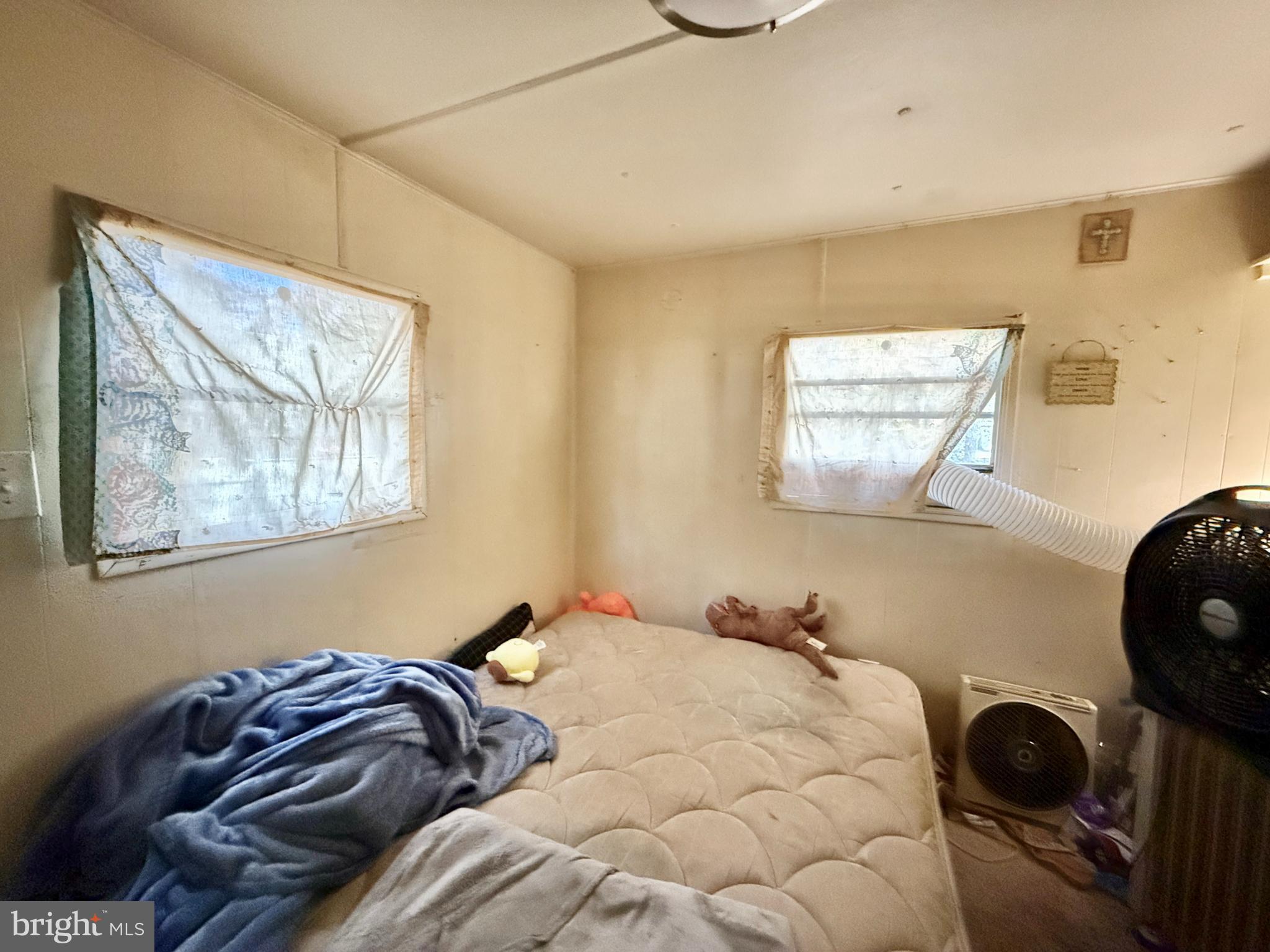 250 Jute Road Millville, NJ 08332 - Photo 7 of 11 a bedroom with a bed and a painting on the wall