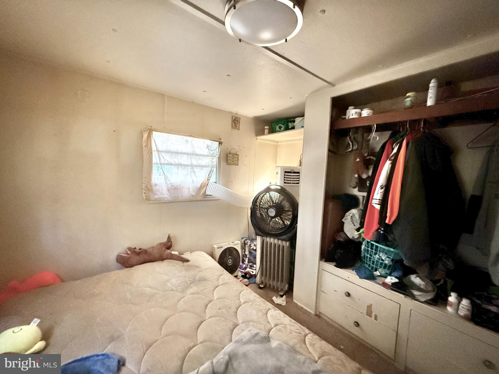 250 Jute Road Millville, NJ 08332 - Photo 8 of 11 a bedroom with a bed and a large mirror on the dresser