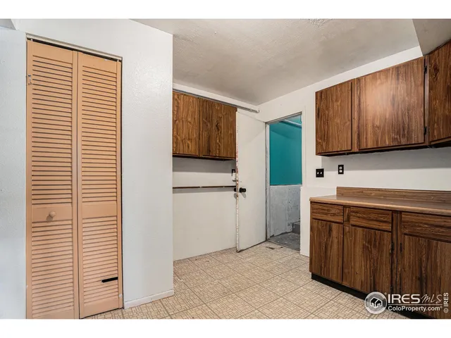 a porch with a bench in front of it