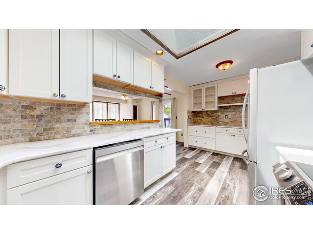 a kitchen with appliances and cabinets