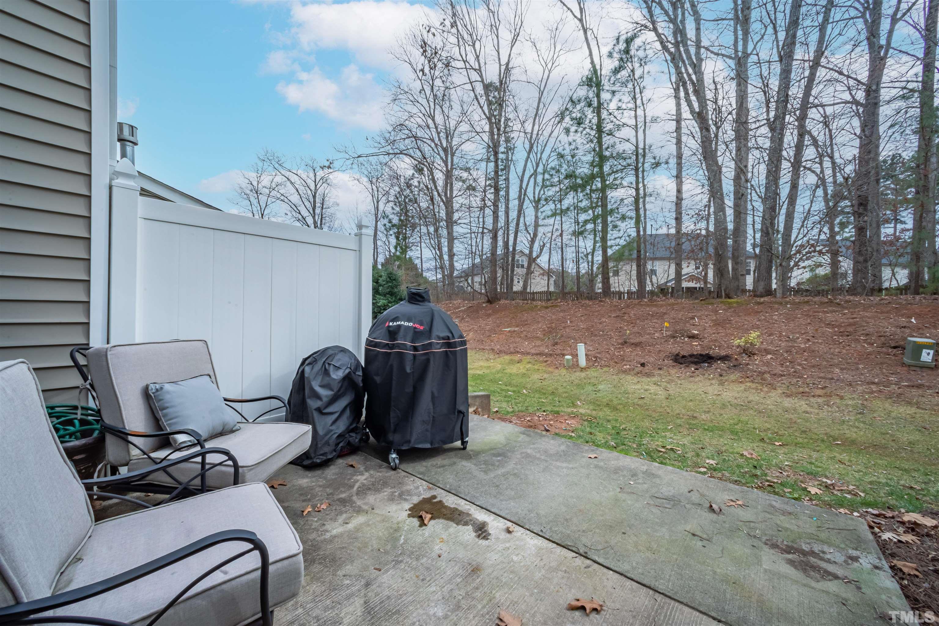 8447 Central Drive Raleigh, NC 27613 - Photo 17 of 19 a couple of chairs sitting in backyard of house