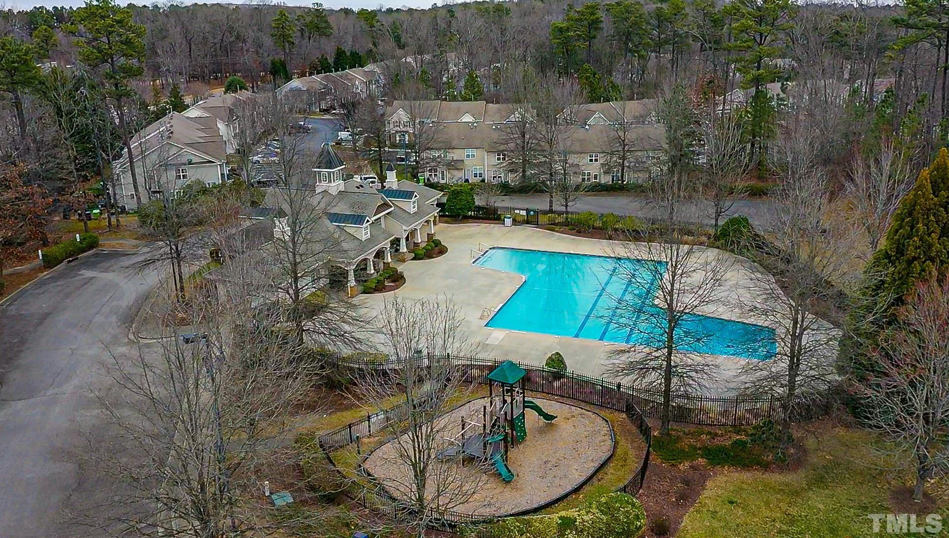 8447 Central Drive Raleigh, NC 27613 - Photo 18 of 19 an aerial view of a house with a yard and lake view