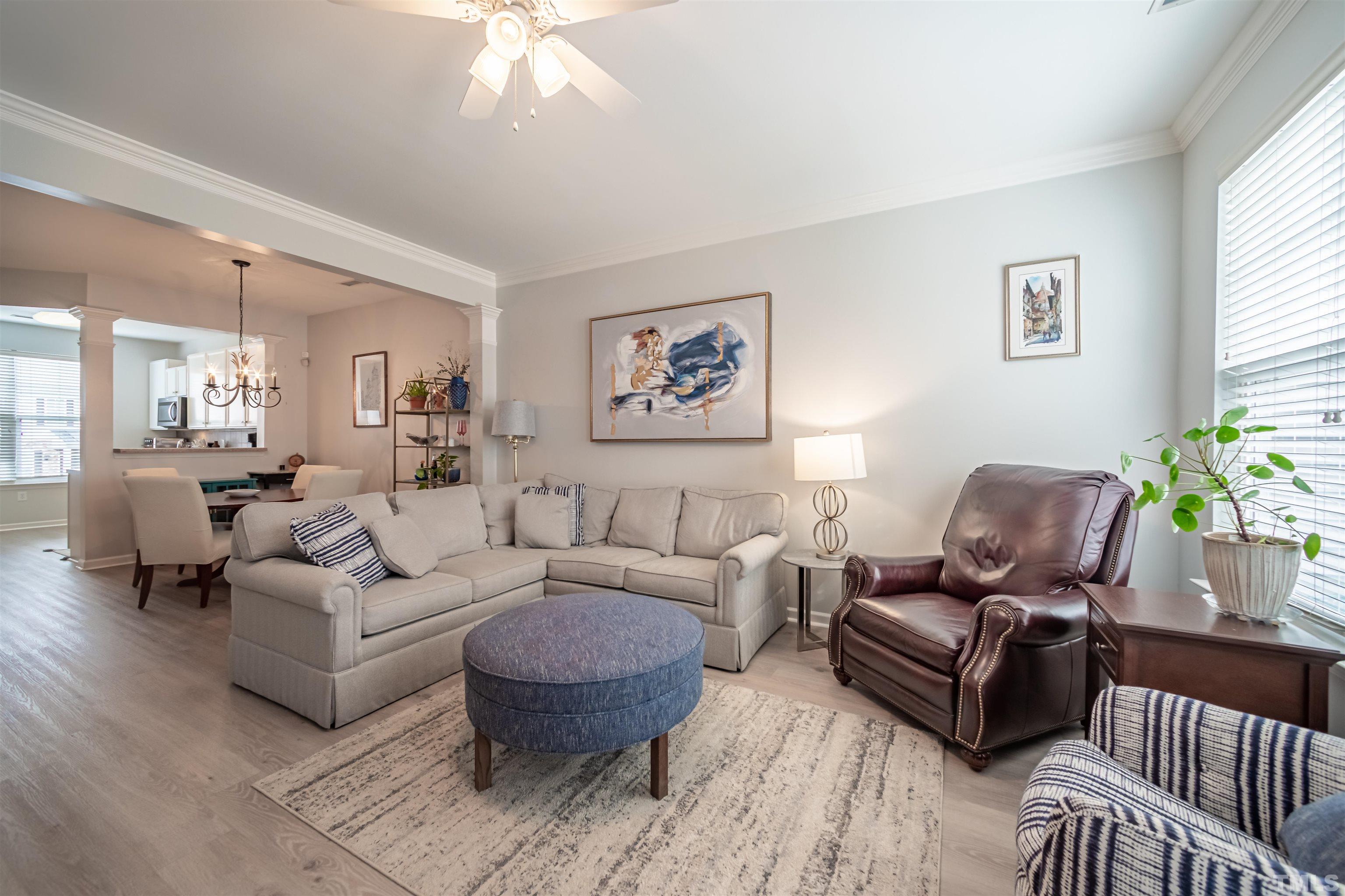 8447 Central Drive Raleigh, NC 27613 - Photo 7 of 19 a living room with furniture or couch and a potted plant