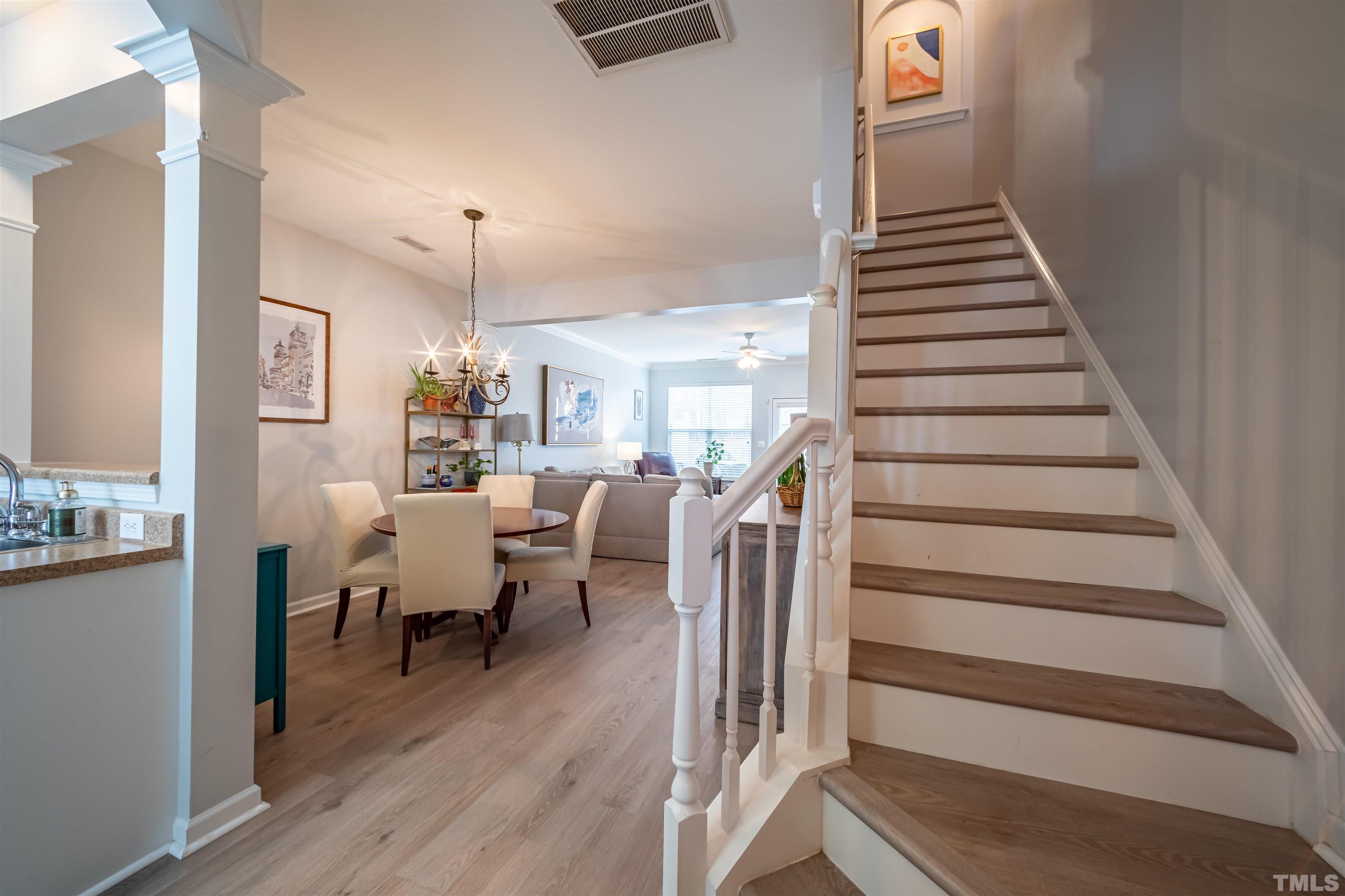 8447 Central Drive Raleigh, NC 27613 - Photo 9 of 19 a view of entryway and hall with wooden floor