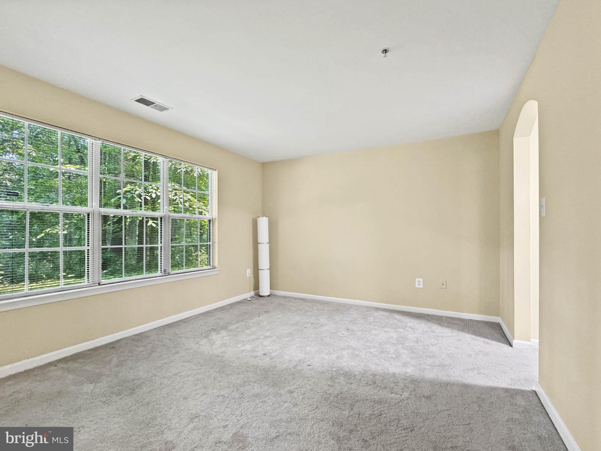 125 Timberbrook Lane, Unit T2 Gaithersburg, MD 20878 - Photo 17 of 30 a view of an empty room with a window