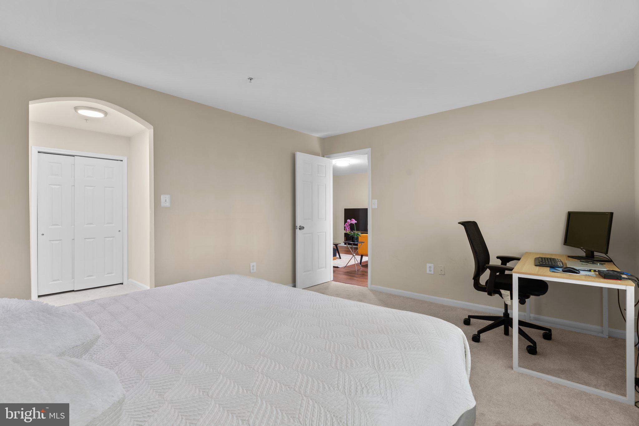 125 Timberbrook Lane, Unit T2 Gaithersburg, MD 20878 - Photo 20 of 30 a bedroom with a bed and chair