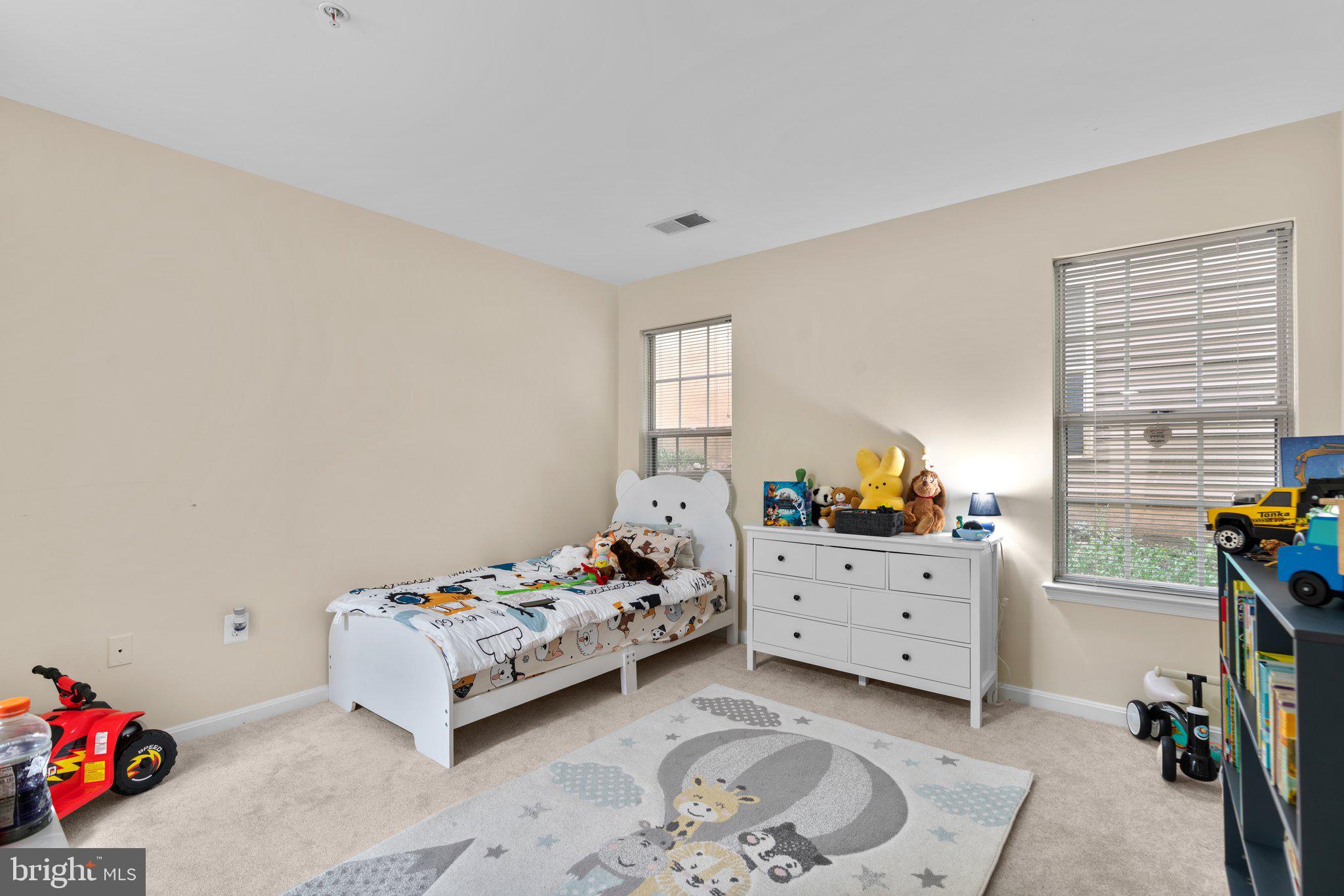 125 Timberbrook Lane, Unit T2 Gaithersburg, MD 20878 - Photo 24 of 30 a bedroom with a bed and a window