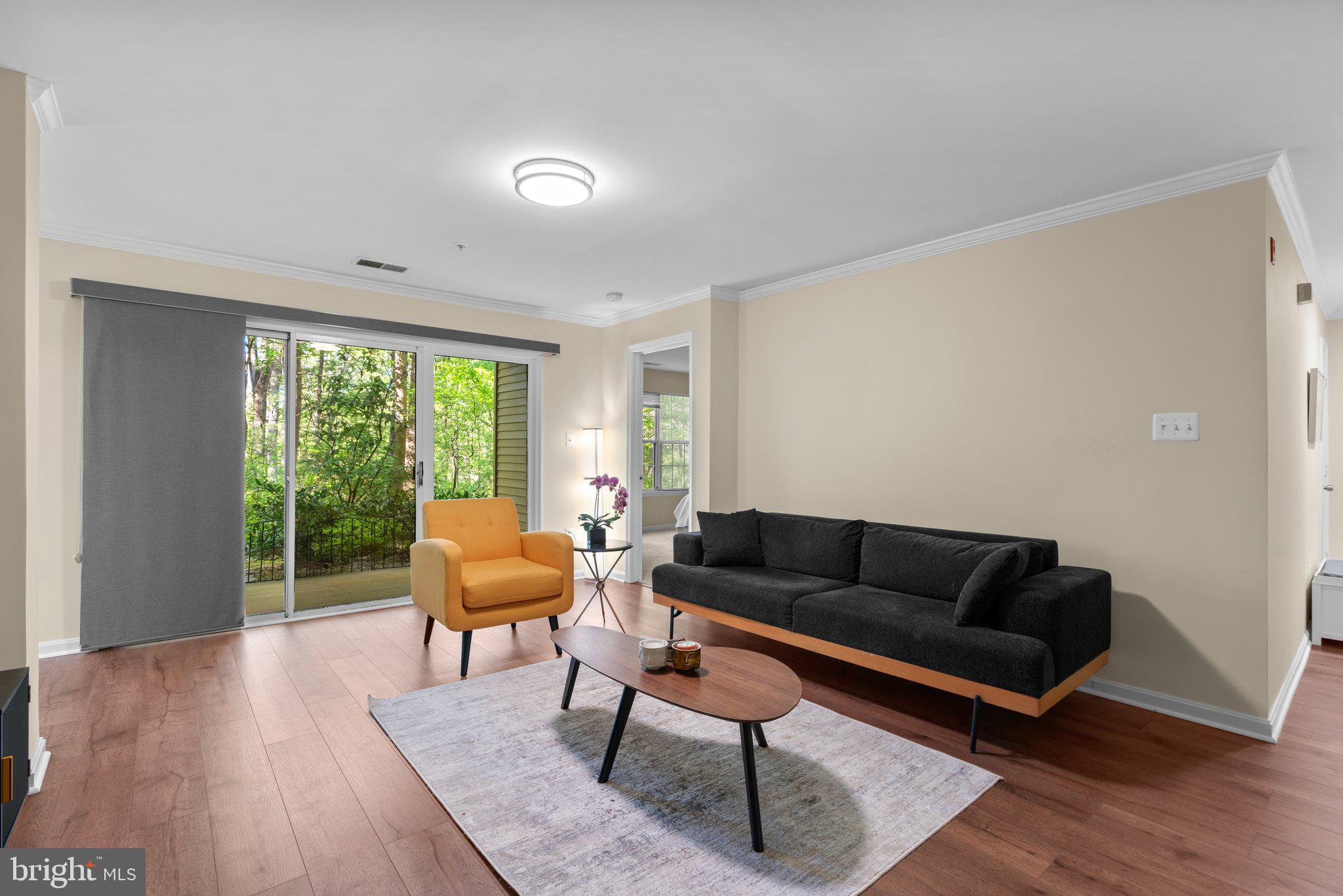 125 Timberbrook Lane, Unit T2 Gaithersburg, MD 20878 - Photo 6 of 30 a living room with furniture and a window