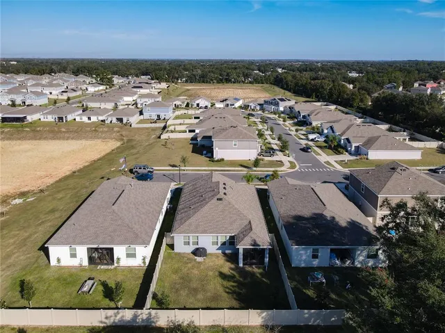 a view of house and yard with green space