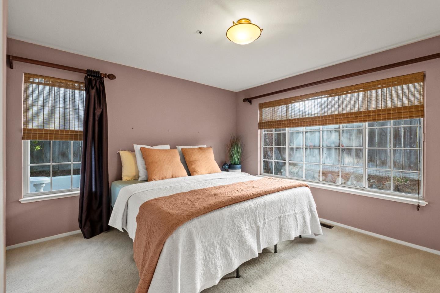 4 Primrose Circle Seaside, CA 93955 - Photo 11 of 22 a bedroom with a large bed and a large window