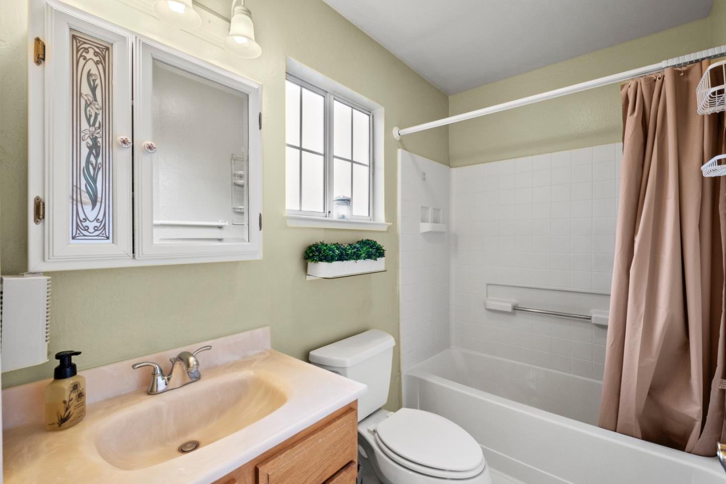 4 Primrose Circle Seaside, CA 93955 - Photo 12 of 22 a bathroom with a sink toilet and shower