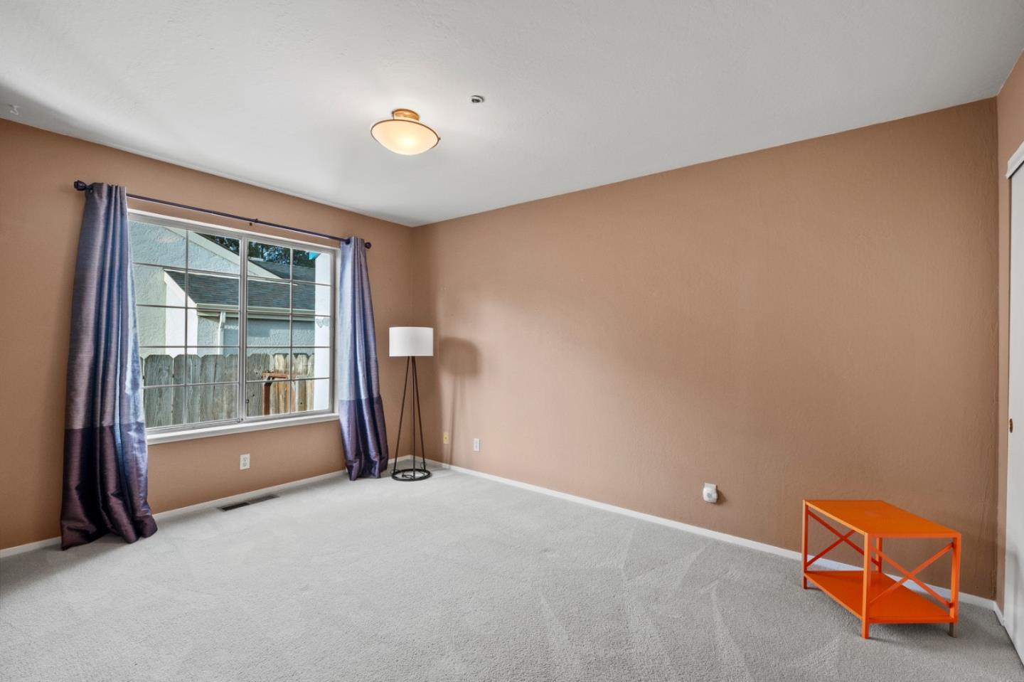 4 Primrose Circle Seaside, CA 93955 - Photo 17 of 22 an empty room with floor to ceiling window and glass door