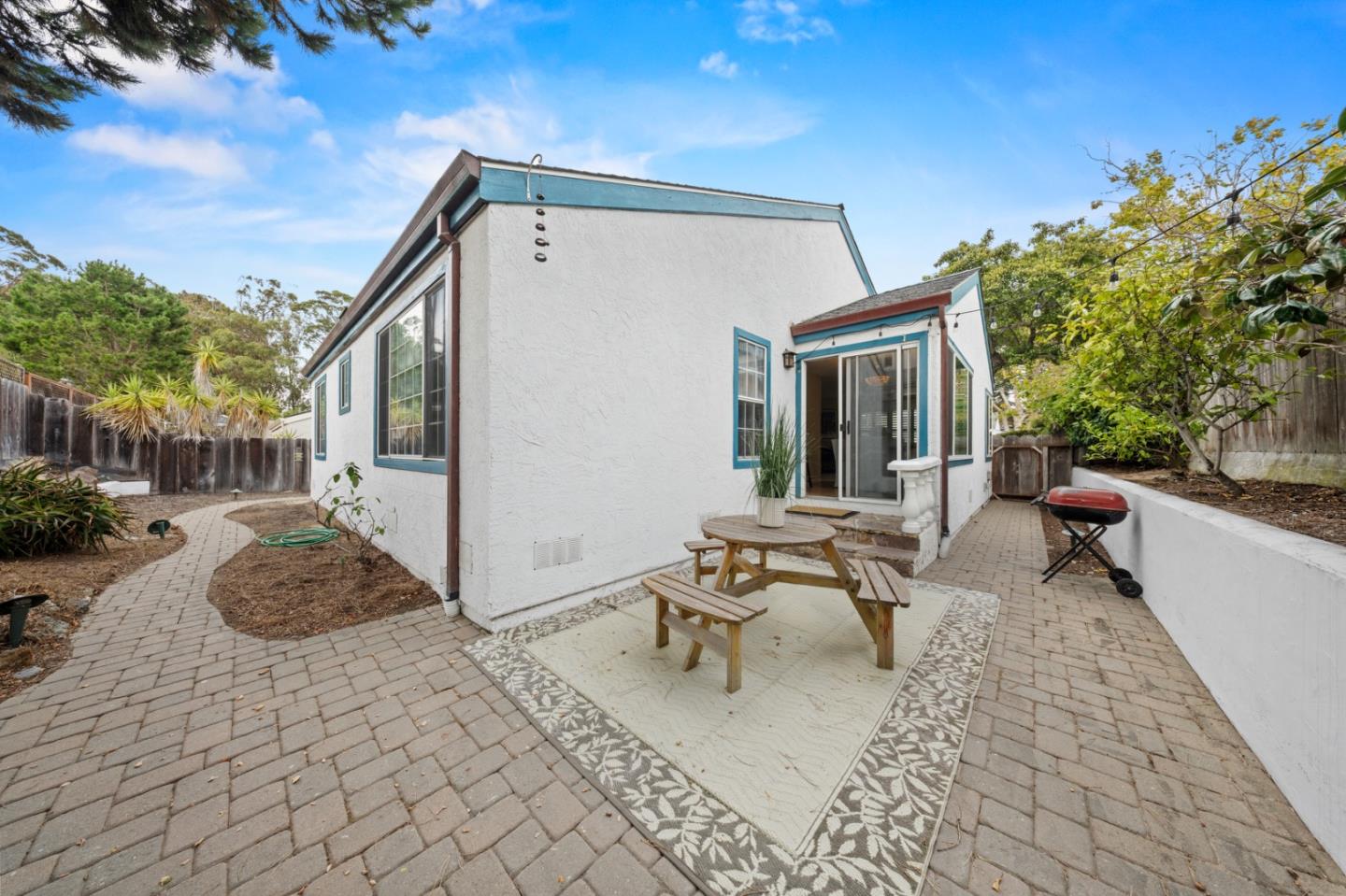 4 Primrose Circle Seaside, CA 93955 - Photo 20 of 22 a view of a patio with table and chairs and potted plants