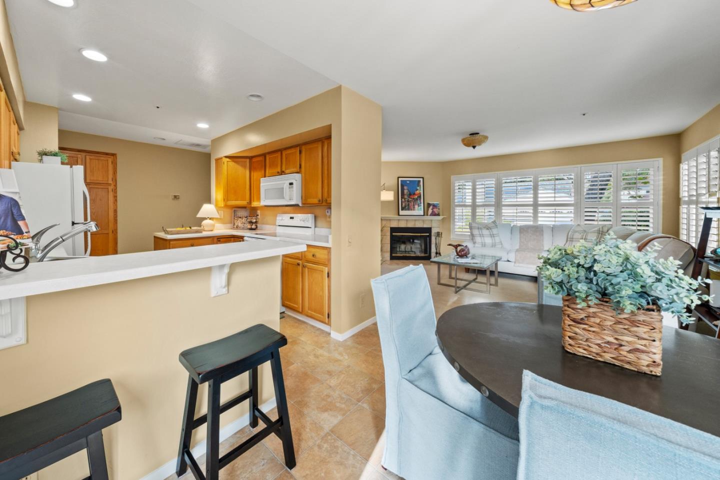 4 Primrose Circle Seaside, CA 93955 - Photo 7 of 22 a kitchen with a table chairs sink and cabinets