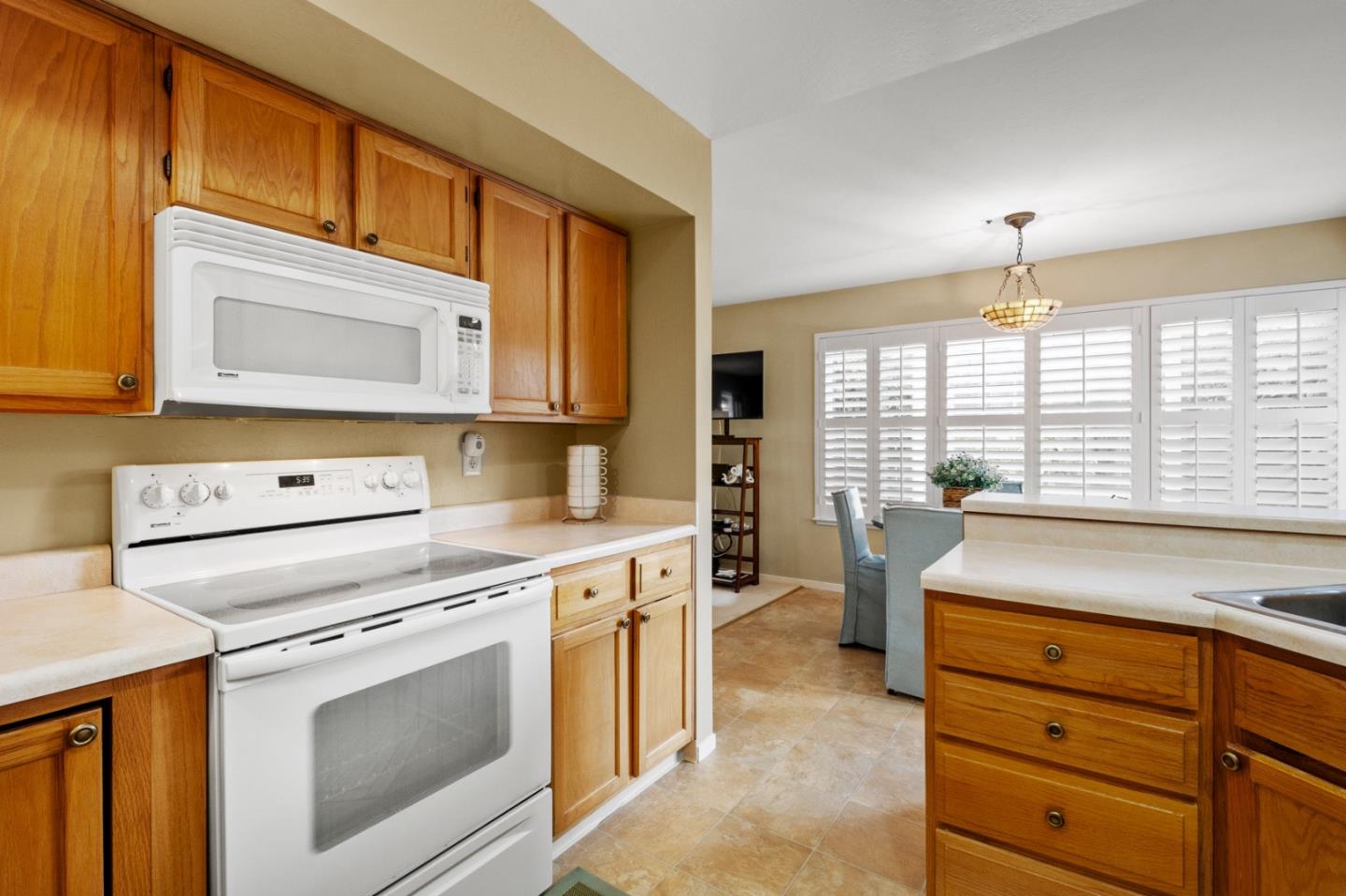 4 Primrose Circle Seaside, CA 93955 - Photo 9 of 22 a kitchen with a stove microwave and refrigerator
