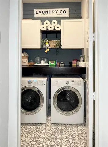 a kitchen with a washer and dryer