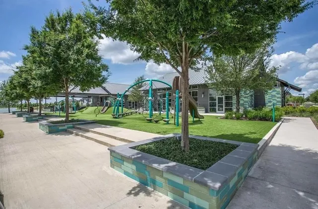 a view of a park with plants and trees