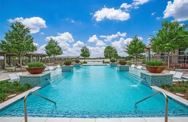 a view of a swimming pool with a patio
