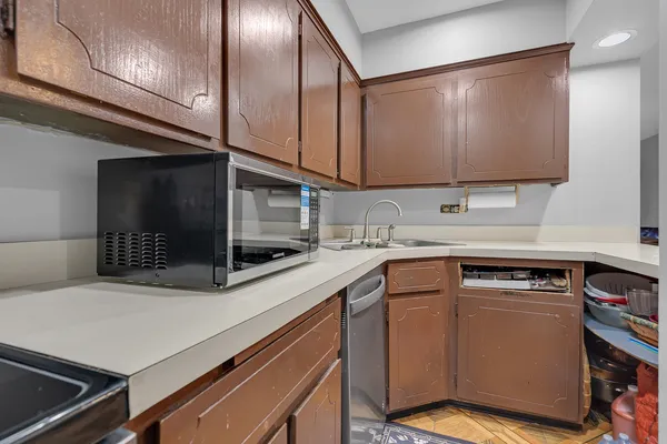 a kitchen with stainless steel appliances granite countertop a sink and cabinets
