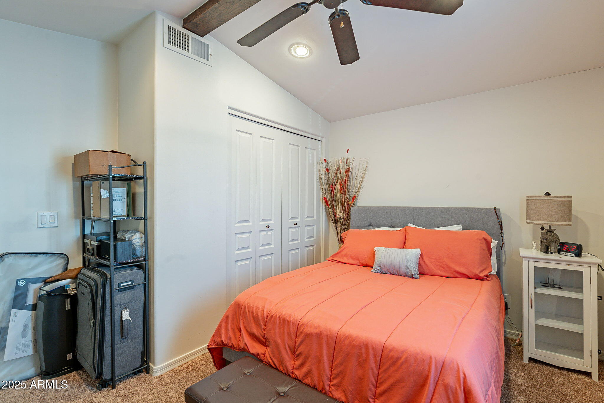 15606 South Gilbert Road, Unit 63 Chandler, AZ 85225 - Photo 19 of 21 a bedroom with a bed and walk in closet