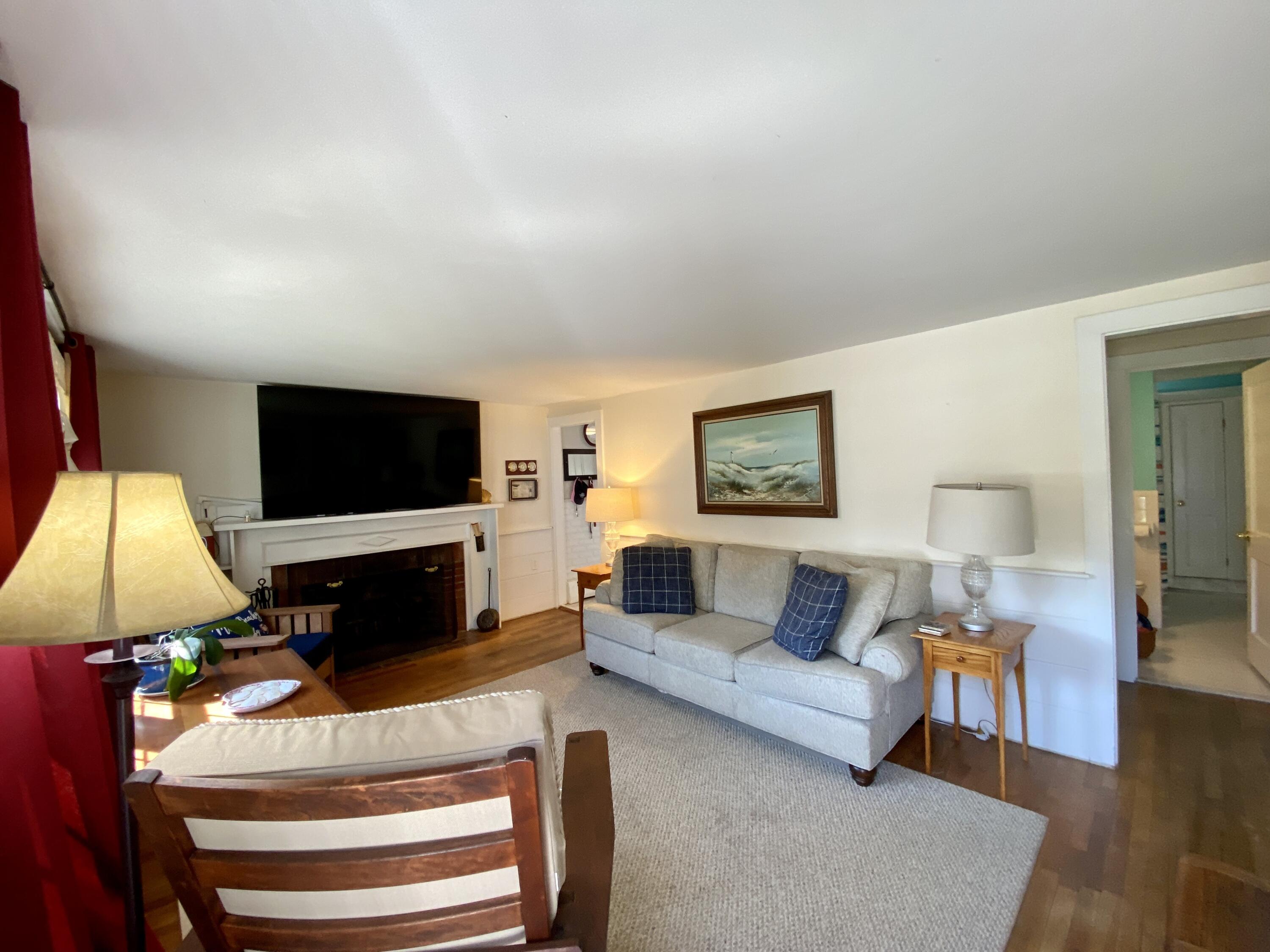 23 Naushon Road Dennis Port, MA 02639 - Photo 17 of 31 a living room with furniture and a flat screen tv